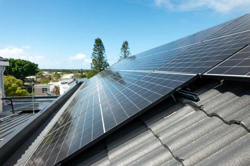 Rows of solar panels installed by LuxGrid on a tiled Hope Island roof